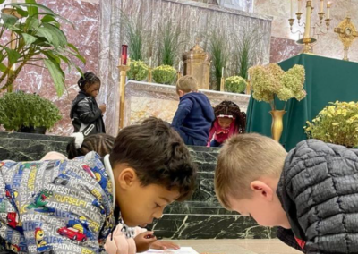 Children coloring during Adoration at Holy Cross Parish