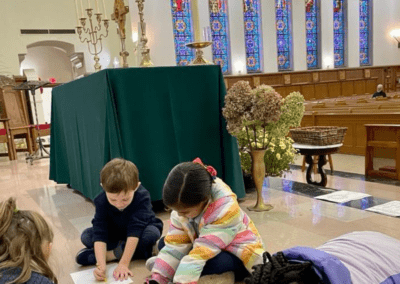 Children coloring during Adoration at Holy Cross Parish