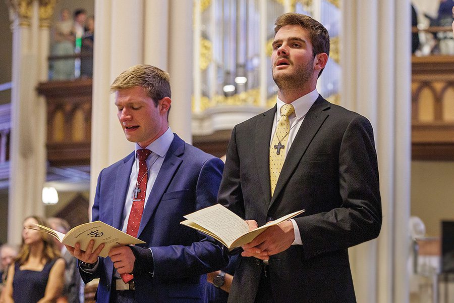 Crowley, Poche Final Vows 2024 seminarian praying at Log Chapel Mass at Notre Dame