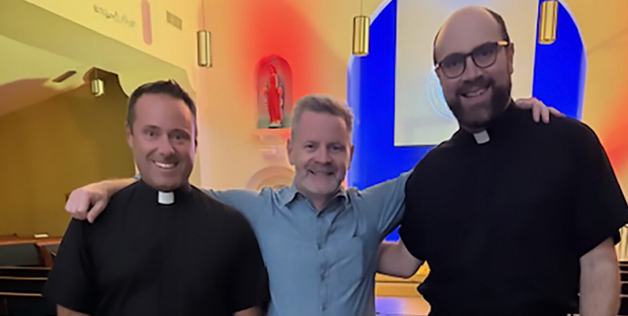 Fr David Halm and Fr Brian Kennedy with parishioners at St. John Vianny parish.