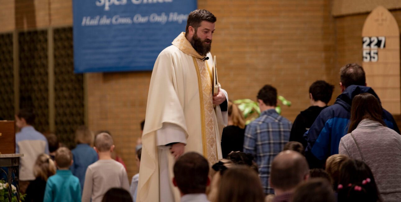 Fr. Matt Fase dismissing youth for children's ministry work at St. Joseph Church in South Bend
