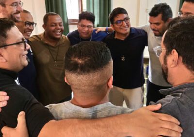 Group hug of young religious meeting in Chile-Peru