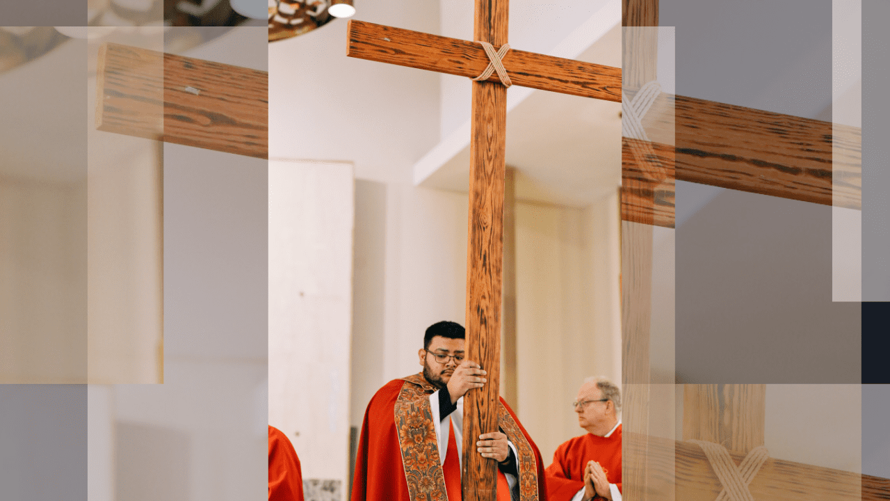 Fr. Felipe Campos C.S.C. carrying wooden cross