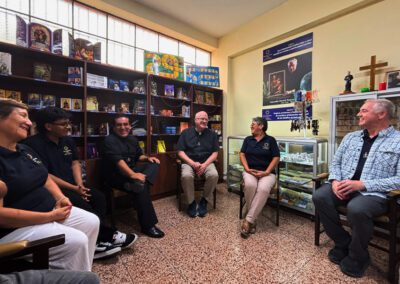 Group of educators sitting in a circle talking with Fr. Bill Lies, C.S.C., and Fr. Tom Eckert, C.S.C., during a Chile-Peru visit in March 2026.