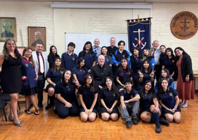 Group photo of students with Fr. Bill Lies, C.S.C., in March 2026 during a visit to Chile-Peru.