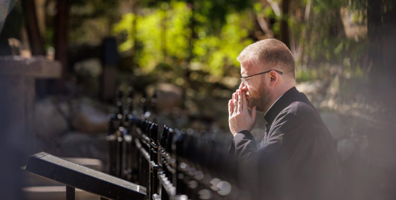 Brother Robert McFadden praying at the grotto at the University of Notre Dame.