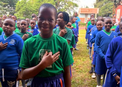 Students say morning prayers in the classroom at St Andrew's Holy Cross Nursery and Primary School.
