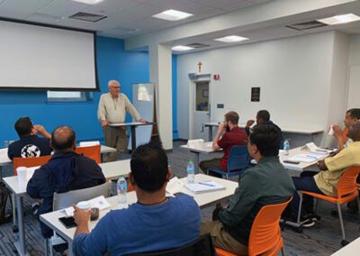 Brother Paul Bednarczyk, C.S.C., speaks to 20 Holy Cross brothers and priests from around the world participated in a three-week Congregational Formation for Leaders Program which was held at the University of Notre Dame.