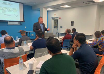 Mr. Jack Brennan speaks to 20 Holy Cross brothers and priests from around the world participated in a three-week Congregational Formation for Leaders Program which was held at the University of Notre Dame.