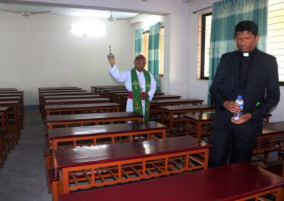 Rev. Thadeus Hembrom, C.S.C., and Rev. Mrinal Michael Mrong, C.S.C., bless the newly constructed Notre Dame College, Mymensingh.