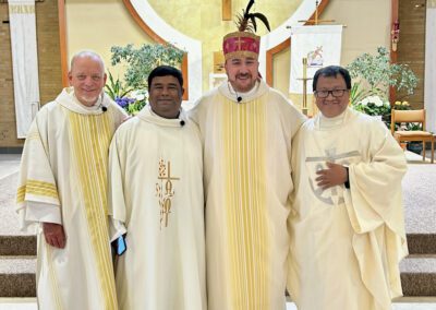 Gathered are religious of the Congregation of Holy Cross at the altar at Christ the King church in South Bend, Indiana.