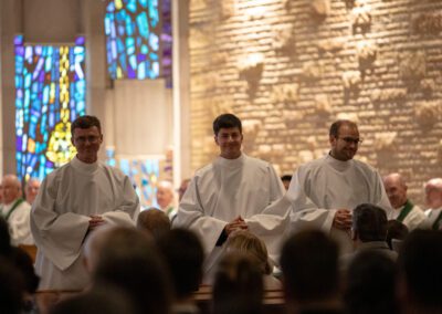 Rev. Mr. Timothy Paul Wymore, C.S.C., Rev. Mr. Andrew James Copp, C.S.C., and Rev. Mr. Keenan James Bross, C.S.C., stand at the altar during Ordination to the Diaconate.