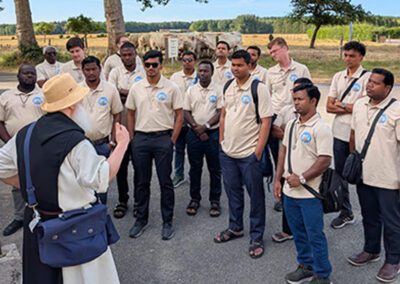 Group of men listening to a lecture at the Final Vows program in Le Mans, France.