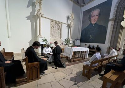 Group of men celebrating Mass at the Final Vows program in Le Mans, France.