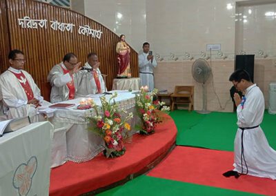 Men at the Sacred Heart of Jesus church assembled in front of the altar during the First Vows ceremony.