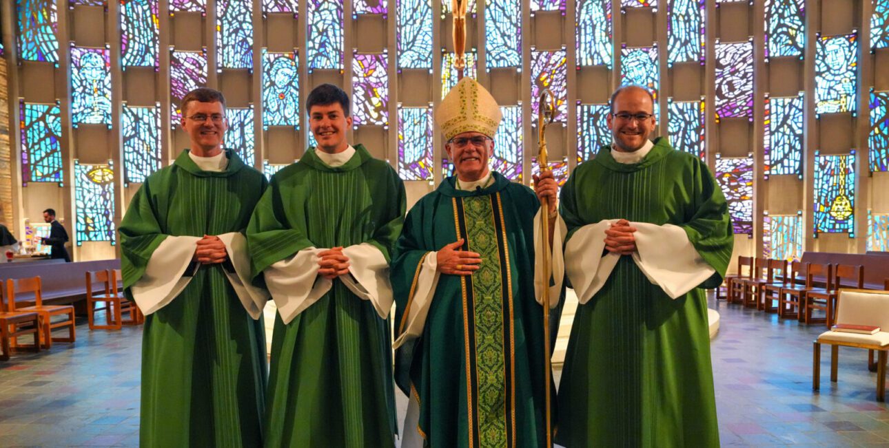 Pictured from left to right Deacon Timothy Wymore, C.S.C., Deacon Andrew Copp, C.S.C., Bishop Kevin Rhoades, and Deacon Keenan Bross, C.S.C.