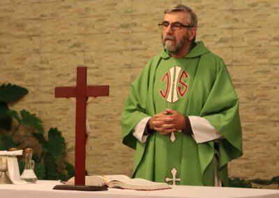 Fr Phalen, C.S.C., stands at the altar during Mass at the Peru assembly.