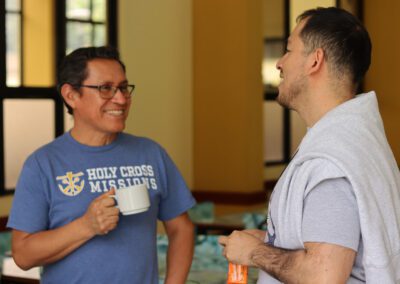 Two members of the Congregation of Holy Cross in Peru enjoy a cup of coffee and conversation at the Peru assembly